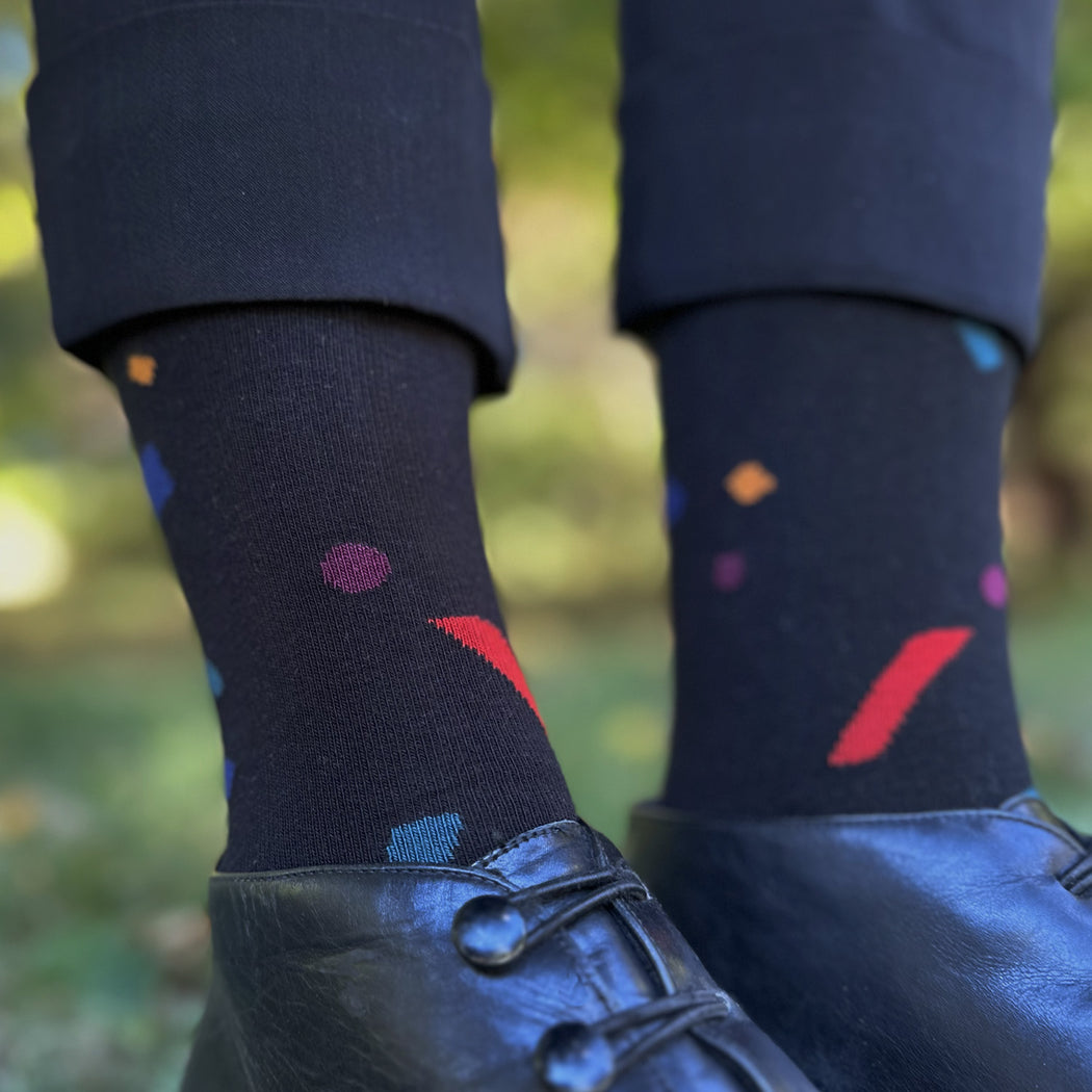 Made in USA fun women's black cotton socks with red, blue, green, and yellow confetti by THIS NIGHT